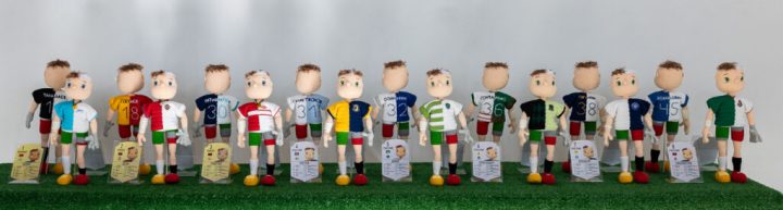 A series of crocheted football players, in various uniforms representing personalized statistics.