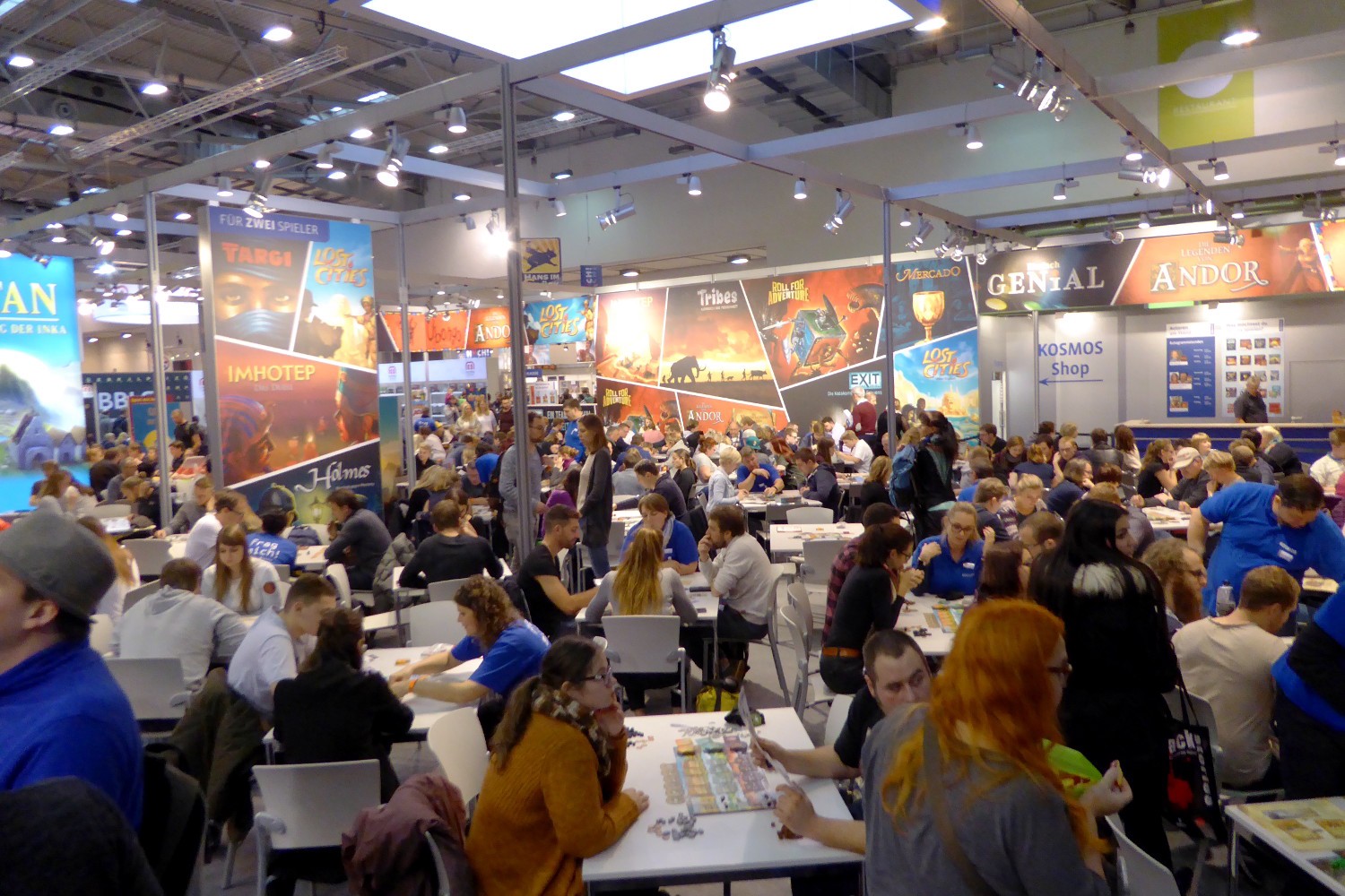 Visitors test playing board game