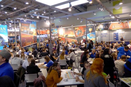 Visitors test playing board game