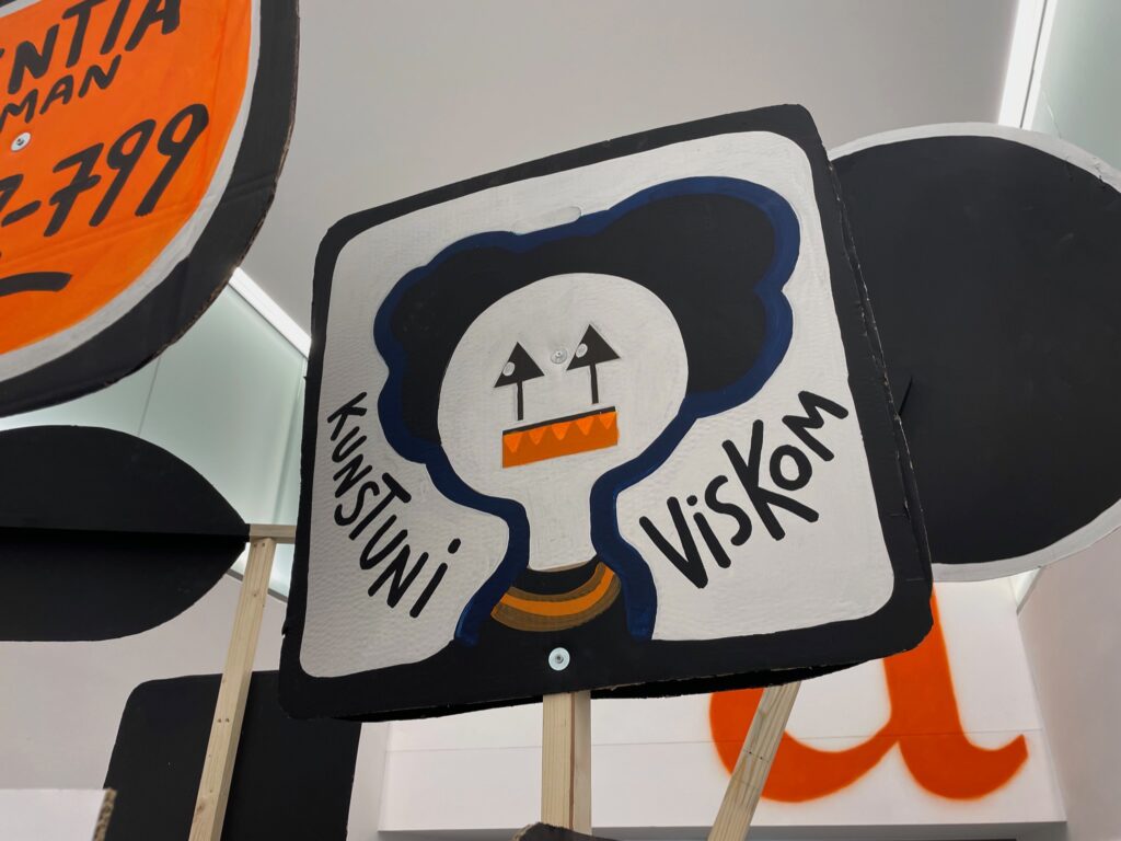 This VisKom sign was made from symbols on the recycled cardboard