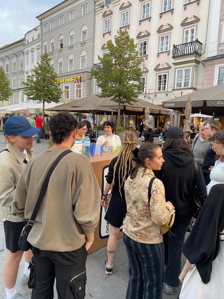 students wait in line before the bar chart