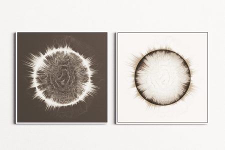 Two square artworks next to each other, each showing a circle made of rhythmic lines on a blank background, one with a white circle on dark background and the other with a dark circle on white background