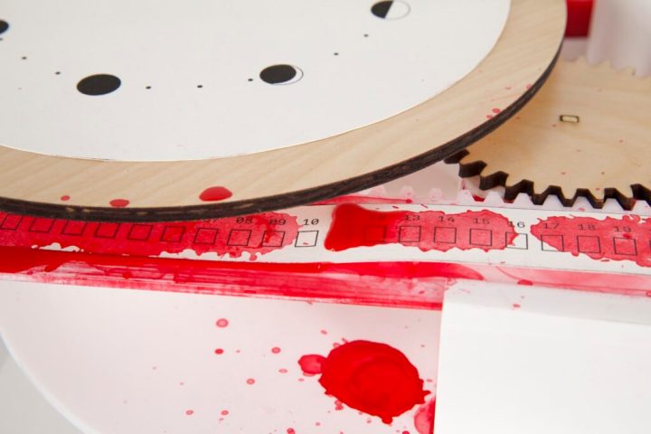 A close-up photo of the moving paper with the 31 days, nearly all of which are covered in red.
