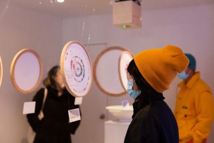 A photo of people reading the data visuals.