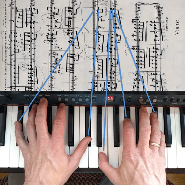 Hands on a piano with thin blue lines to corresponding notes on sheet music.