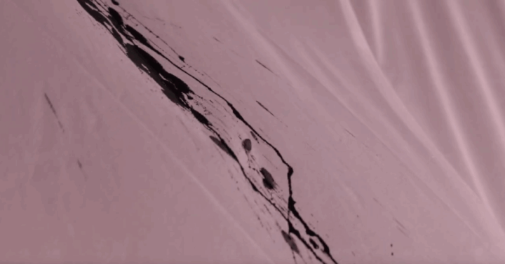 A close-up photo of the black ink on the fabric.