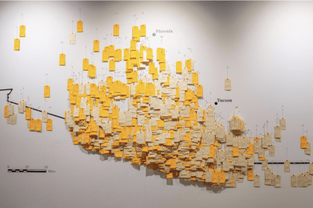 Wall map depicting toe tags of migrants where remains were found
